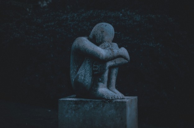 statue of a grieving man