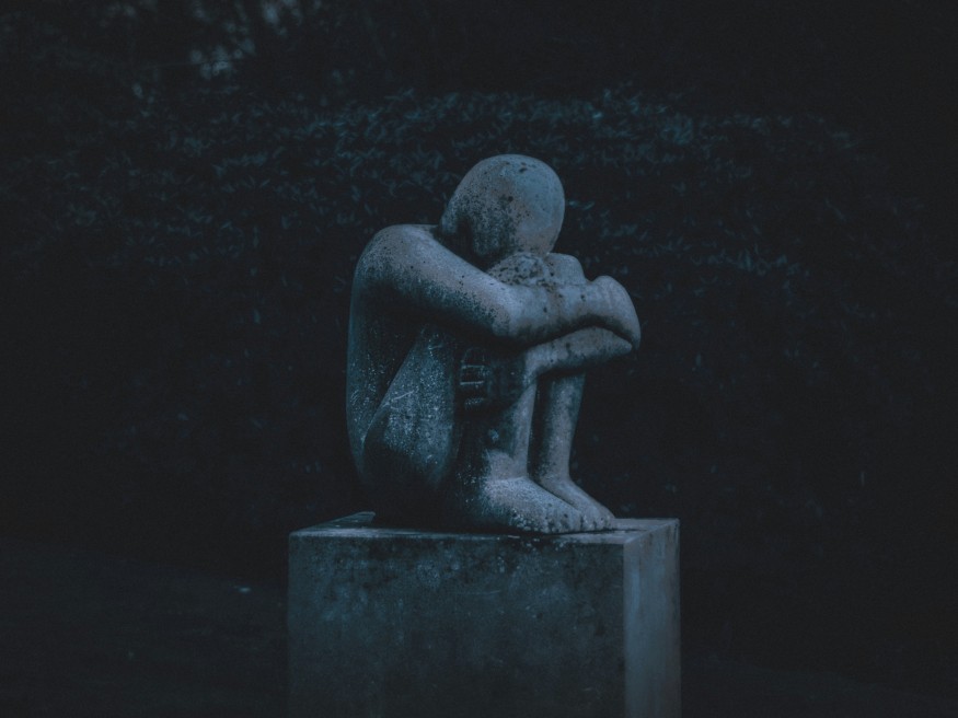 statue of a grieving man
