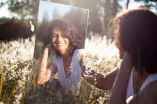 girl looking at mirror