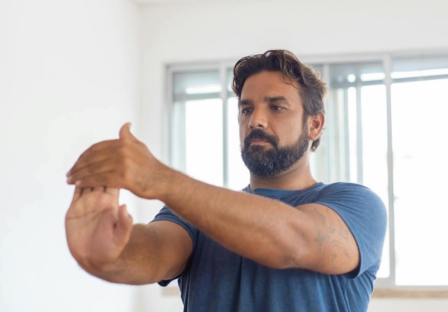 Man stretching hand