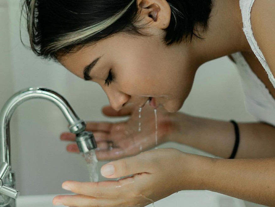 girl washing face